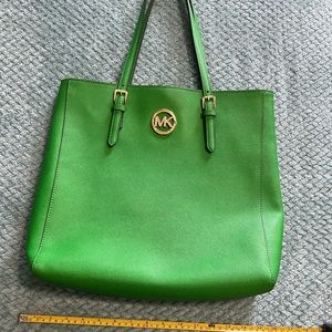 Geeen Michael Kors tote. Great condition. Can use it to carry a laptop.